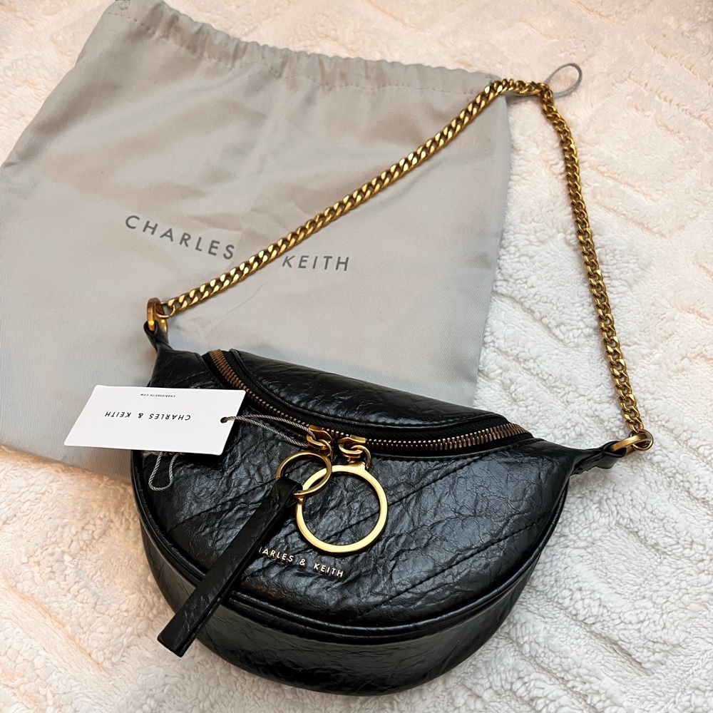 Philomena Wrinkled-effect Half moon Crossbody bag. Charles and Keith Brand